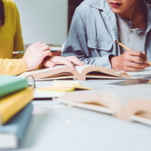 people studying, many books in the front