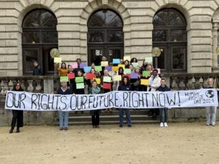 Students with a big banner on Human Rights day