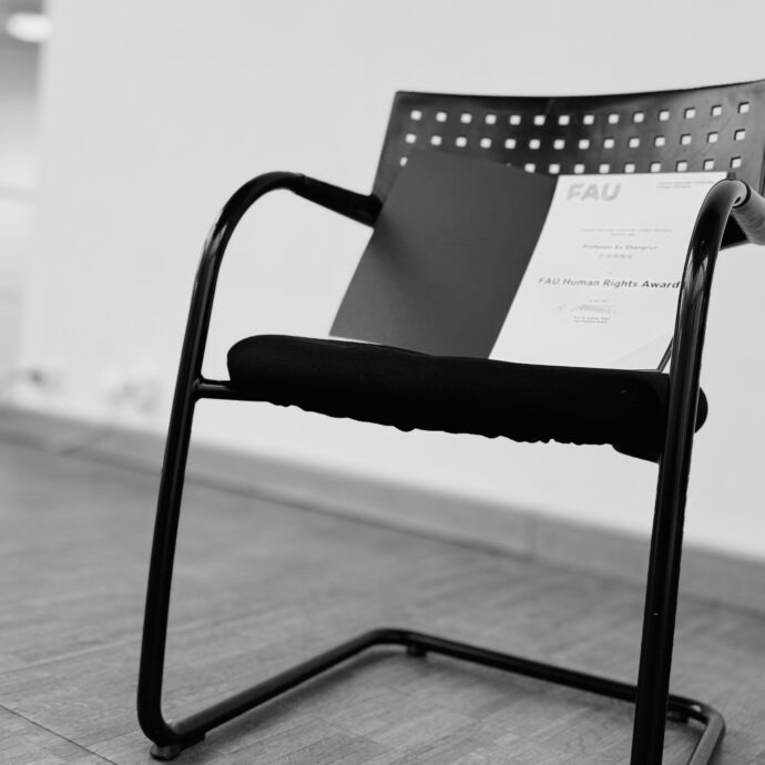 Empty chair with Human Rights award certificate on top